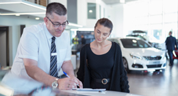 Car salesman and lady customer