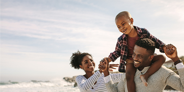 Father, mother playing with their child