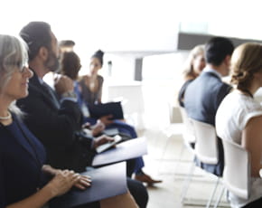 Group of people at a meeting.