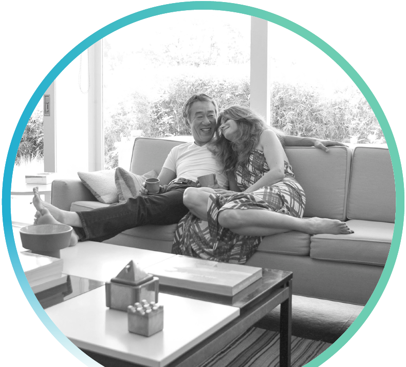 man and woman lounging on a couch