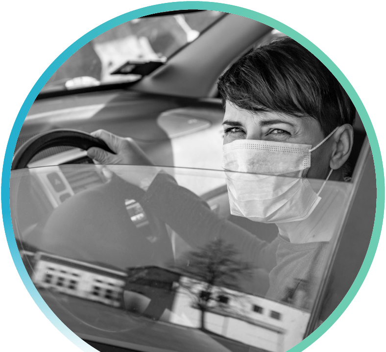 A lady in the car wearing mask