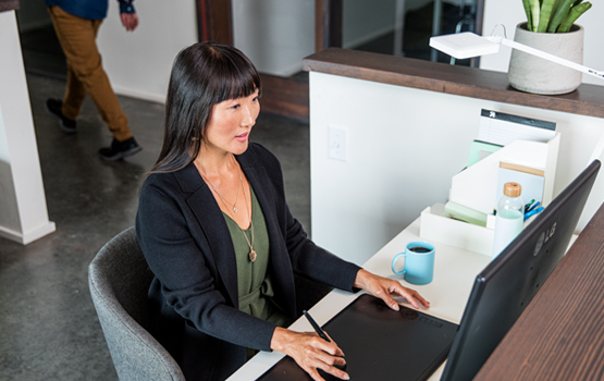 Woman typing on computer