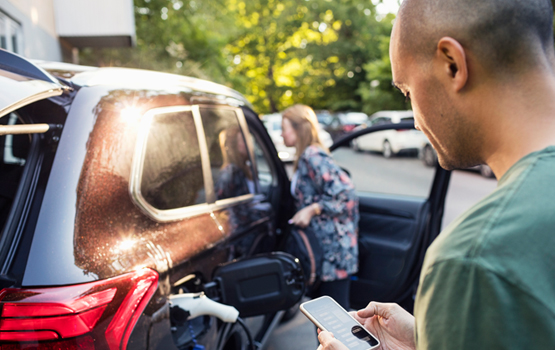 Couple looking at car