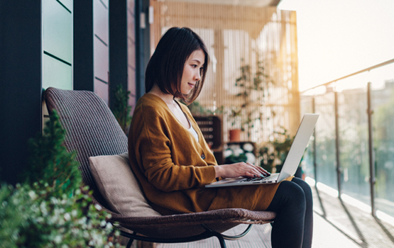 Woman typing on laptop