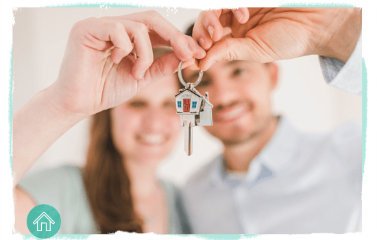 couple holding up house keys
