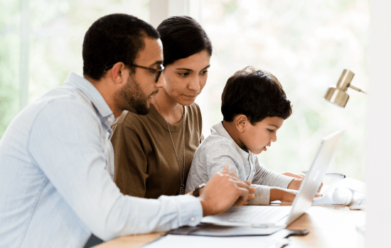 Family working on a laptop together