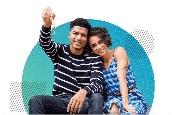 Couple holding keys to new house