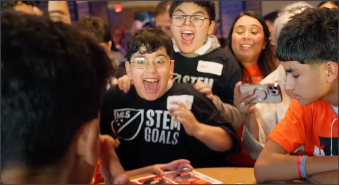 group creaming and celebrating watching game