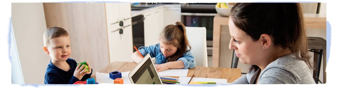 Woman and kitchen table working with children