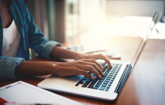 typing on laptop