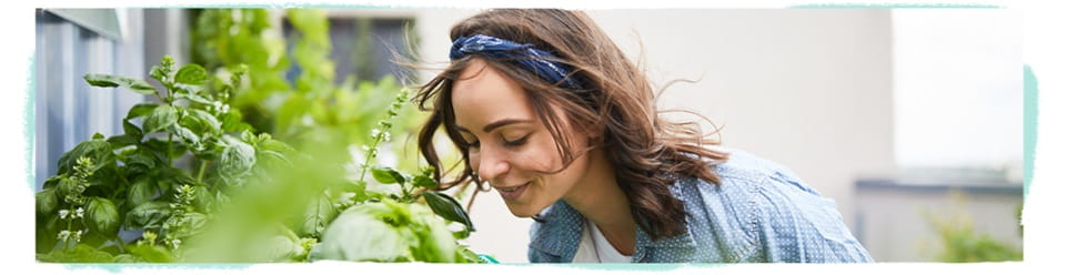 woman smelling flowers