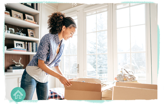 woman at home filling boxes