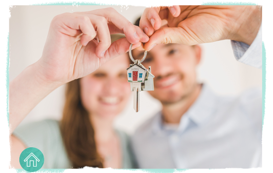 couple holding up house keys