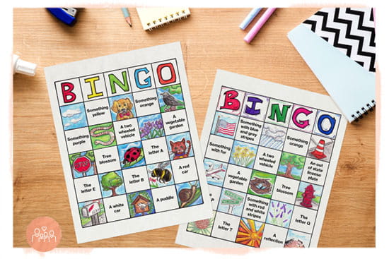 Colorful hand drawn bingo cards on a table.
