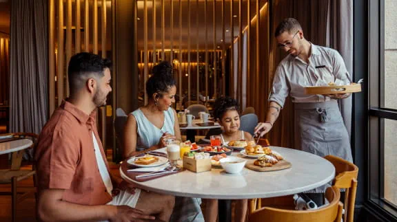 A FAMILY EATING LUNCH