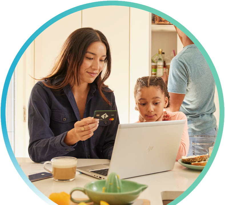 Mother and daughter shopping on their laptop.