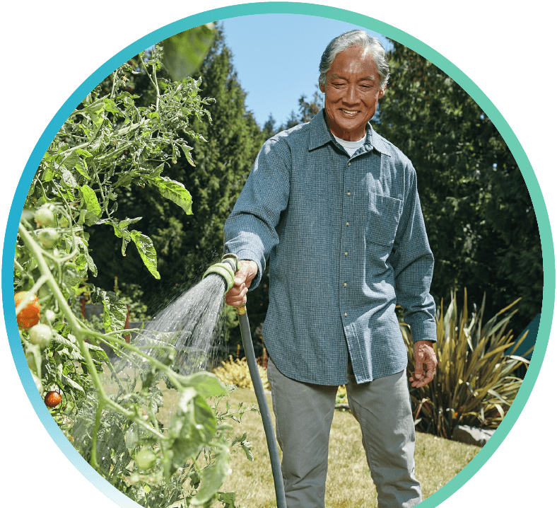 Person watering grass