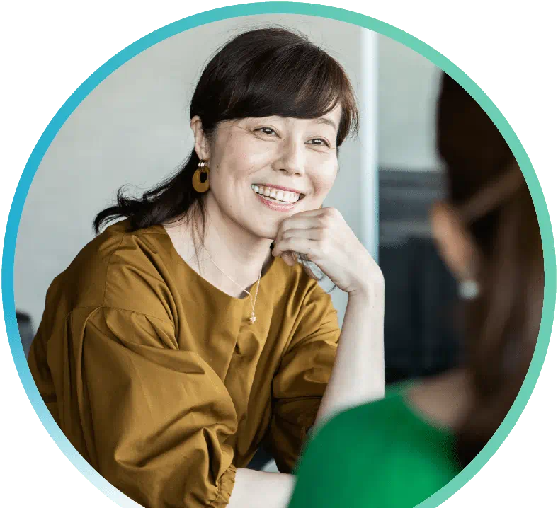 Image of two people talking.