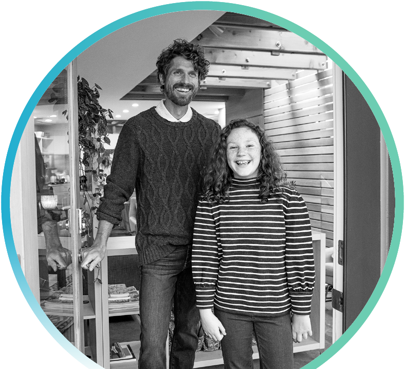 Couple standing in front of home