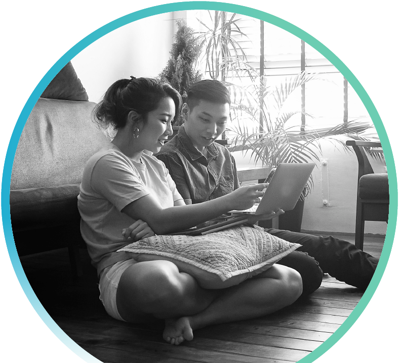 A couple sitting together using a smart tablet