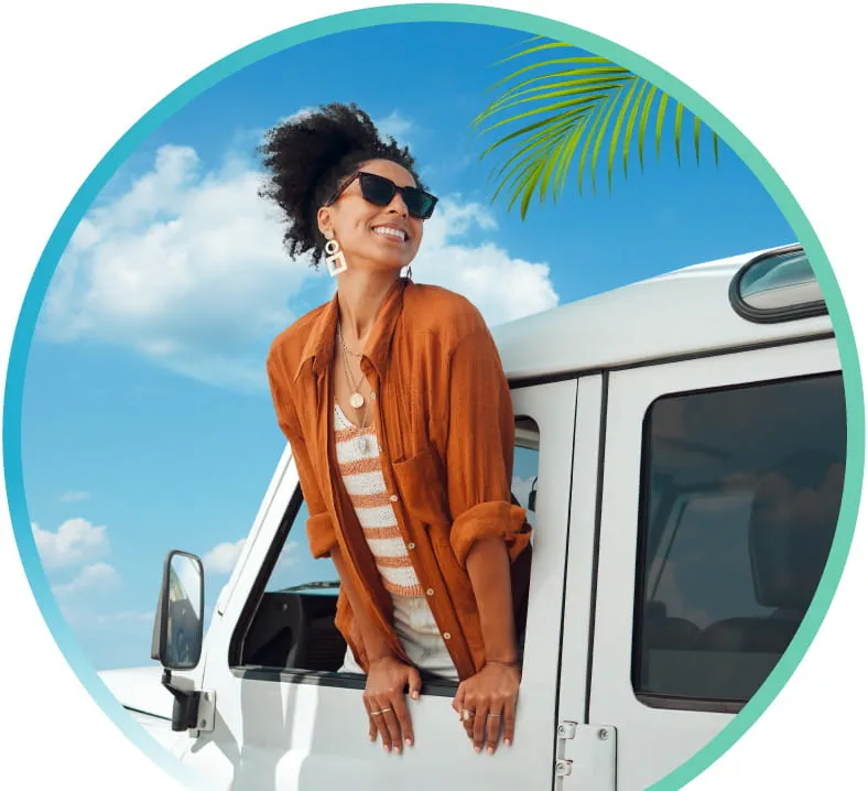 Smiling person in the door of an SUV with blue sky and clouds in the background
