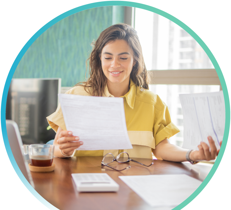 A woman is reviewing a financial document.