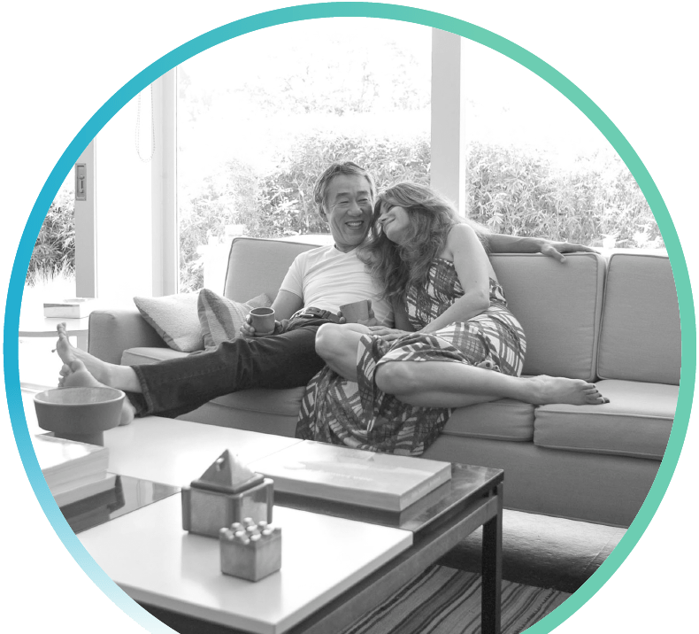 man and woman lounging on a couch