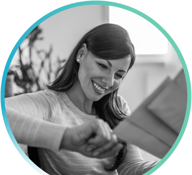 smiling woman with a hand full of mail