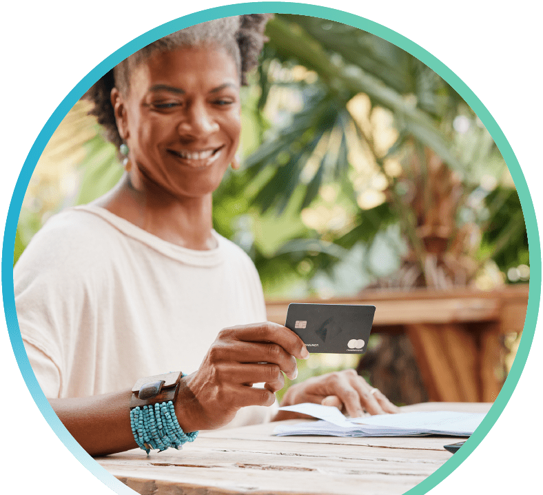 Woman using the Odyssey Rewards credit card