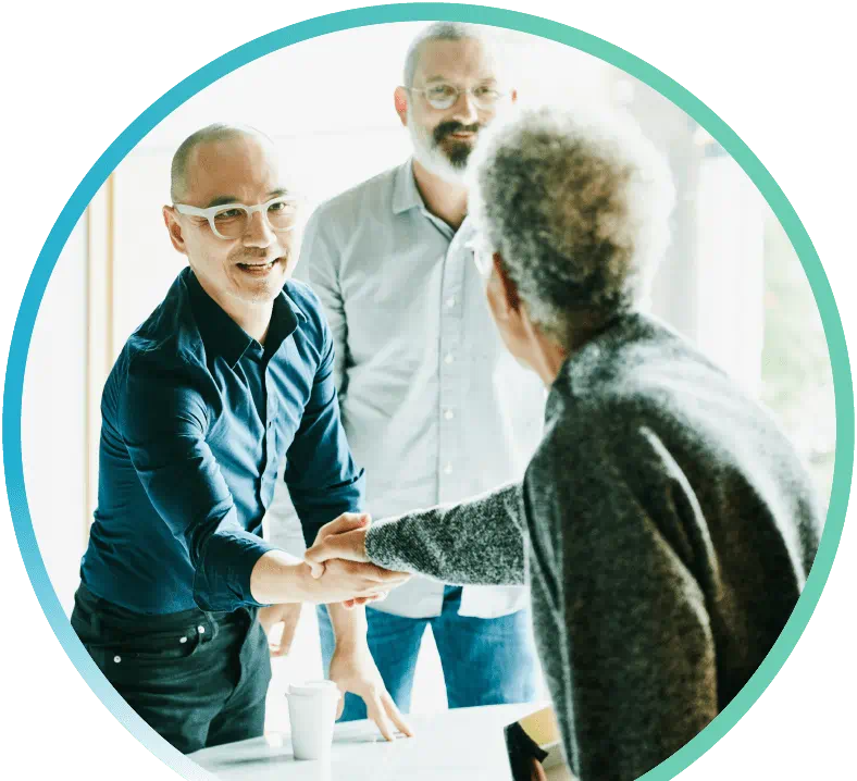 Two men speaking with an agent about professional liability insurance.