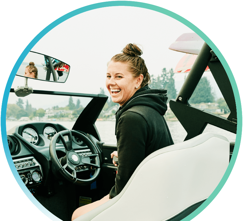 A woman steering a boat.