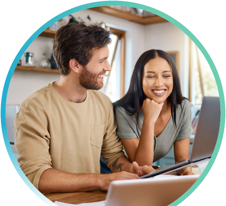 Couple working together on a laptop.