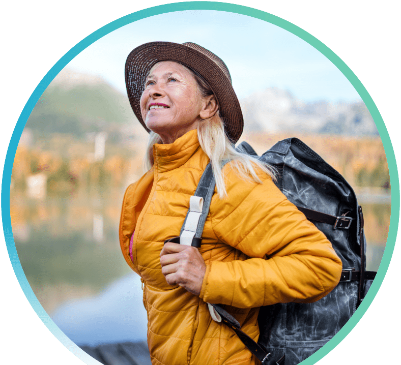 Woman on a hike and carrying a backpack with them.