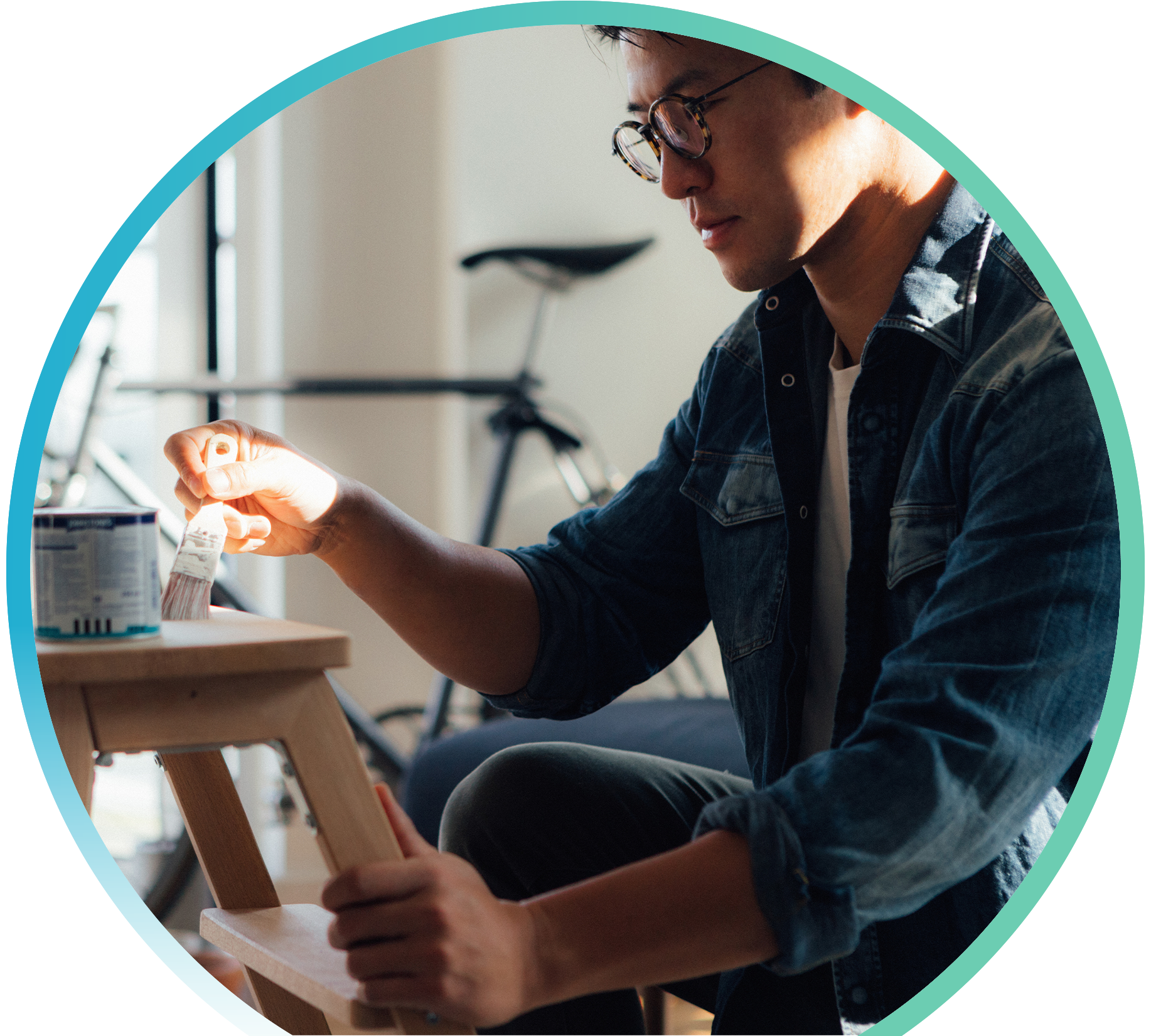 Man painting a foot stool