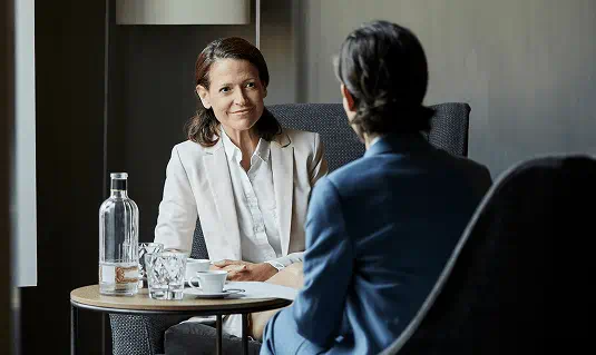 WOMAN TALKING TO A MAN