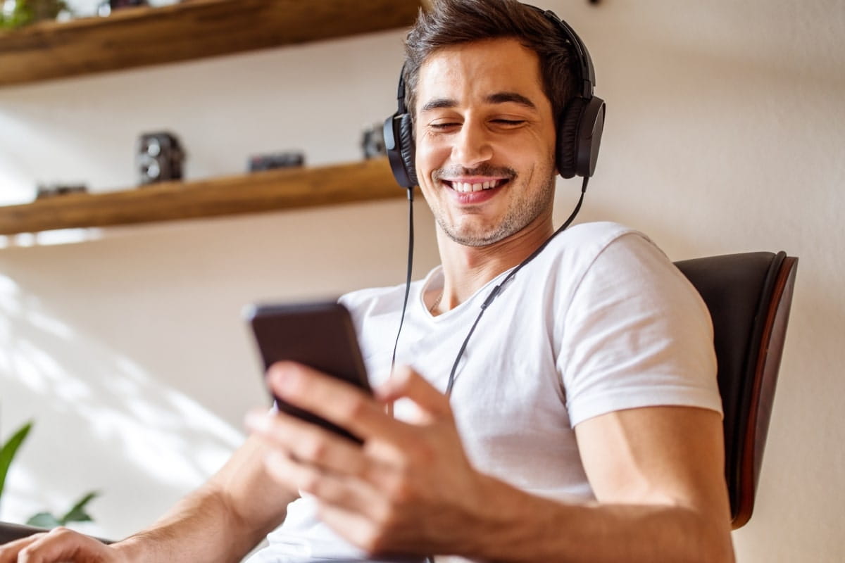 A boy listening to music on his headphones