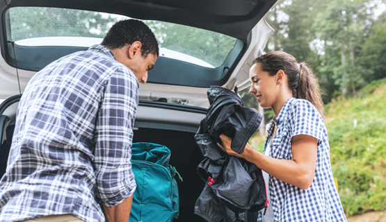 Man and Woman packing car