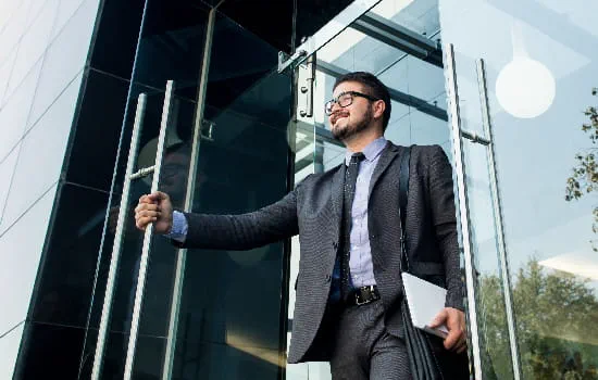 Man walking out of a building.