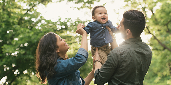 Parents playing with their child