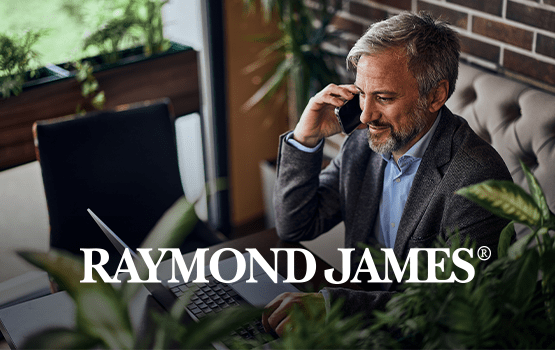 Person on cell phone sitting at a desk overlaid with Raymond James title