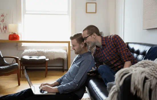 Men looking at laptop